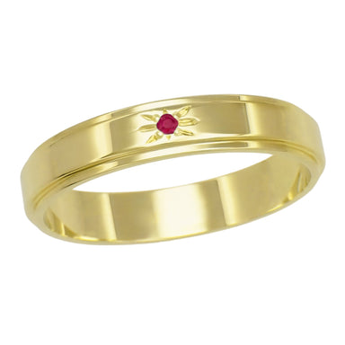 A 14K yellow gold men's wedding ring from the 1950s with a grooved edge and a round brilliant natural red ruby set in the center of a starburst.  R653YR