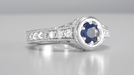 Art Deco Filigree Flowers and Scrolls Engraved Blue Sapphire and Diamond Engagement Ring in White Gold