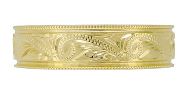 A yellow gold, hand engraved Art Deco style men's wedding band with a vintage western scroll design in 14K, 18K or 10K yellow gold, 6mm wide.