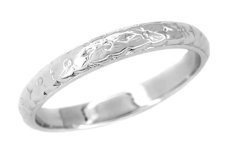 A platinum Art Deco floral embossed antique wedding band ring with a gentle floral pattern all the way around. 2.7mm wide. R164