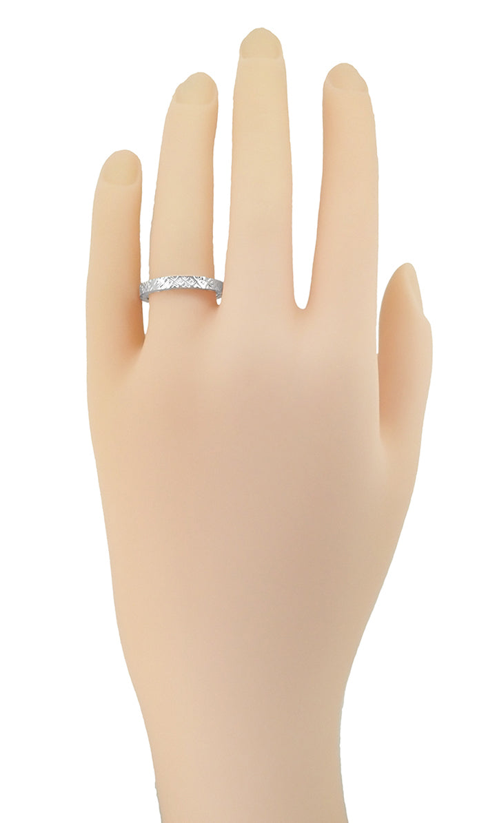 Womens hand with Retro 1950s Vintage Platinum Wedding Band - R623P