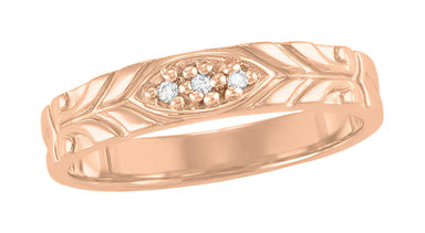 A vintage men's 14K rose gold wedding band featuring a Retro Modern carved sculptural pattern with three diamonds set in the center. - R852R