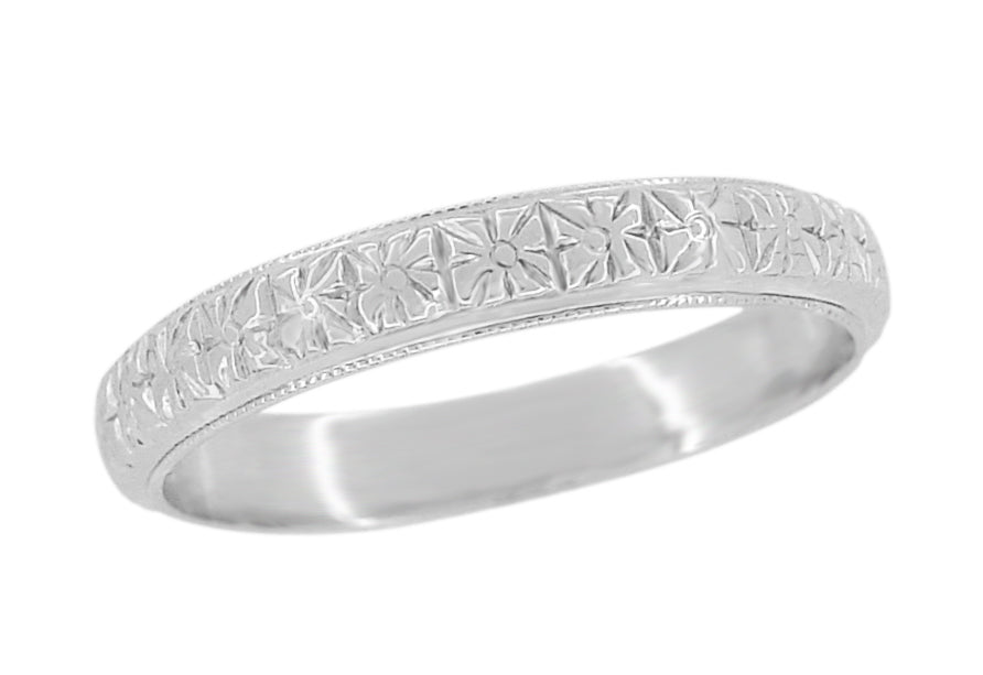 An antique white gold wedding band with a carved floral pattern and millgrain edging, 3.5mm wide. Available in 14K, 10K or 18K white gold. R853