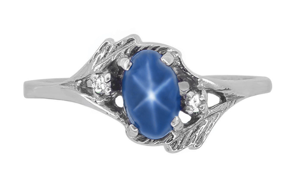 White Gold 1970s Vintage Style Oval Blue Star Sapphire Cabochon Bypass Ring with Side Diamonds