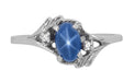 White Gold 1970s Vintage Style Oval Blue Star Sapphire Cabochon Bypass Ring with Side Diamonds