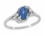 White Gold 1970s Vintage Style Oval Blue Star Sapphire Cabochon Bypass Ring with Side Diamonds
