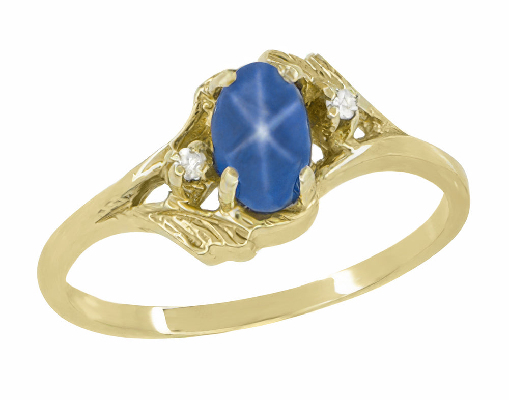 1970s Oval Blue Star Sapphire Cabochon Bypass Twist Ring in Yellow Gold with Side Diamonds - Item: R921YS - Image: 2