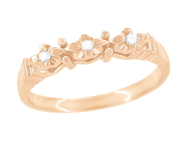 A 1950's rose gold wedding band ring with three round brilliant diamonds set on top, featuring a vintage mid-century design. - WR481R
