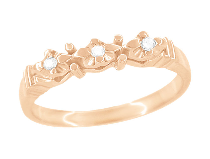 A 1950's rose gold wedding band ring with three round brilliant diamonds set on top, featuring a vintage mid-century design. - WR481R