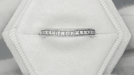White Sapphire Curved Wedding Band in 14 Karat White Gold with Milgrain Edges