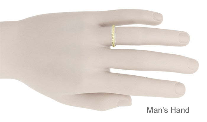 A slim yellow gold band ring displayed on a man's hand mannequin against a white background, with the text 'Man's Hand' in the bottom right corner.