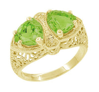 Art Deco Filigree Peridot Loving Duo Trillion Ring in 14 Karat Yellow Gold