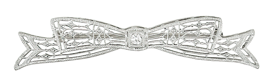 Antique 1920's Art Deco Diamond Set Engraved Filigree Bow Brooch in 14 Karat White Gold