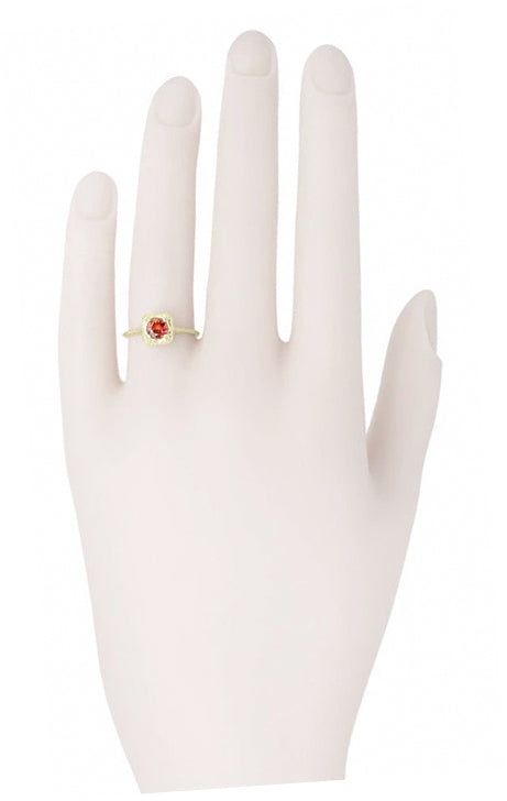R182YAG Yellow Gold Red Garnet Ring On a Hand