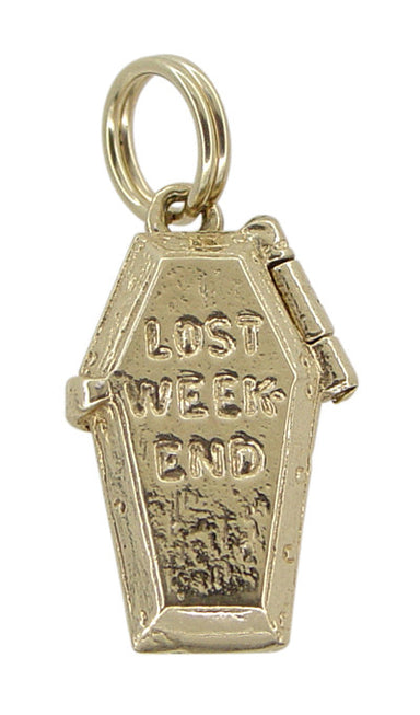 A vintage 14K gold coffin-shaped charm with the inscription 'LOST WEEK END' on the lid, featuring a movable opening hinged lid.