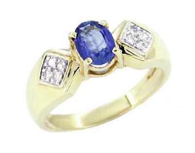 Oval Cut Sapphire Estate Ring Flanked by Diamonds in 14 Karat Gold