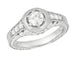 Art Deco Filigree Flowers and Scrolls Engraved 1/2 Carat Diamond Halo Engagement Ring in 14 Karat White Gold