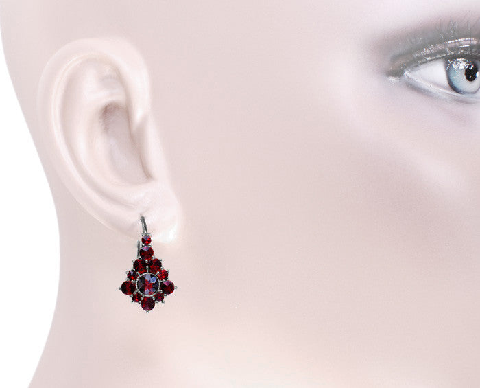 Shown on an Ear - Victorian Rose Cut Bohemian Red Garnet Antique Earrings in Dark Finish Sterling Silver - AE144